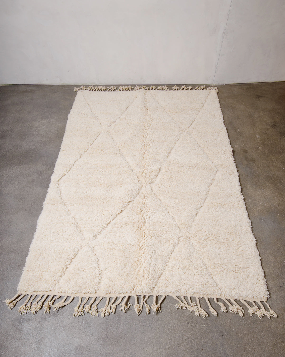 Modern, designer, handcrafted Berber rug from Morocco. Beniourain carpet with minimalist design, natural wool pile and a fluffy texture.